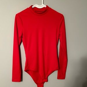 Red turtle neck body suit